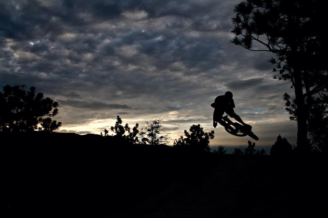 Biker in the air at sunset
